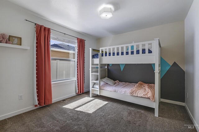 bedroom with visible vents, baseboards, and carpet flooring