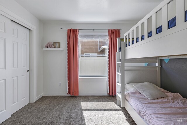 carpeted bedroom with baseboards