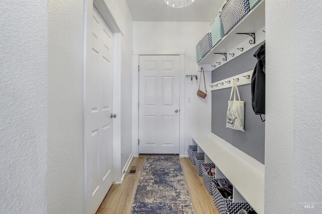 mudroom with visible vents and wood finished floors