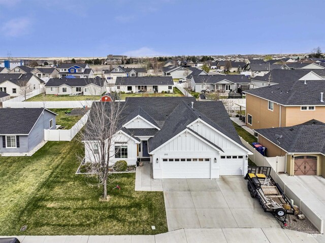 birds eye view of property with a residential view