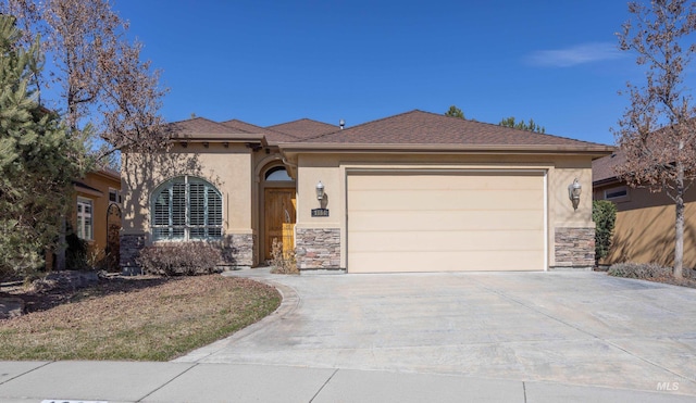 view of front of property with stucco siding, stone siding, a garage, and concrete driveway