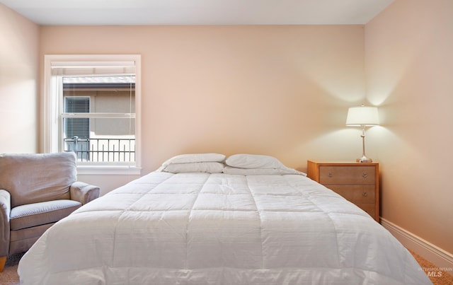 bedroom featuring baseboards