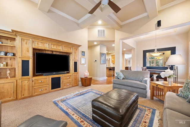 living area featuring visible vents, ceiling fan, light colored carpet, beam ceiling, and coffered ceiling