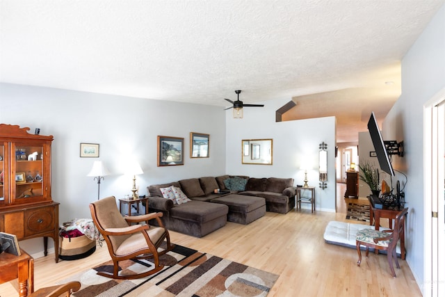 4023 N Bayou Ln, Boise, ID 83703 - living room with a ceiling fan, light wood-style floors, and a textured ceiling