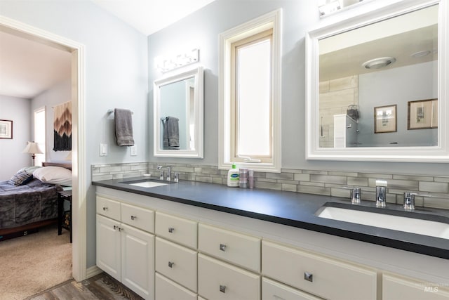 4023 N Bayou Ln, Boise, ID 83703 - ensuite bathroom featuring double vanity, backsplash, and wood finished floors