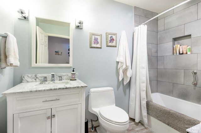 4023 N Bayou Ln, Boise, ID 83703 - full bathroom featuring toilet, shower / tub combo with curtain, vanity, and wood finished floors