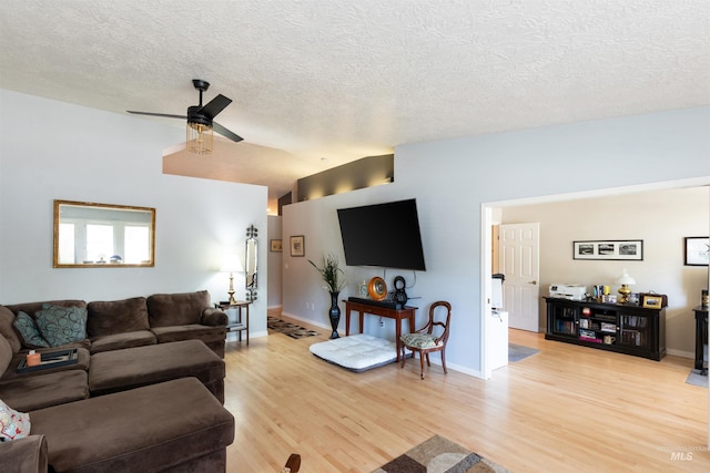 4023 N Bayou Ln, Boise, ID 83703 - living room with a ceiling fan, a textured ceiling, light wood finished floors, and baseboards