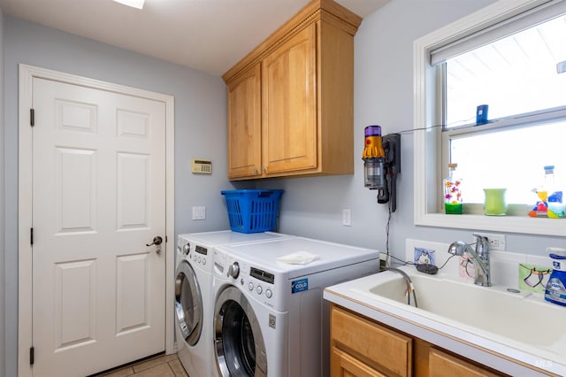 4023 N Bayou Ln, Boise, ID 83703 - laundry area featuring cabinet space, washing machine and dryer, and light tile patterned floors