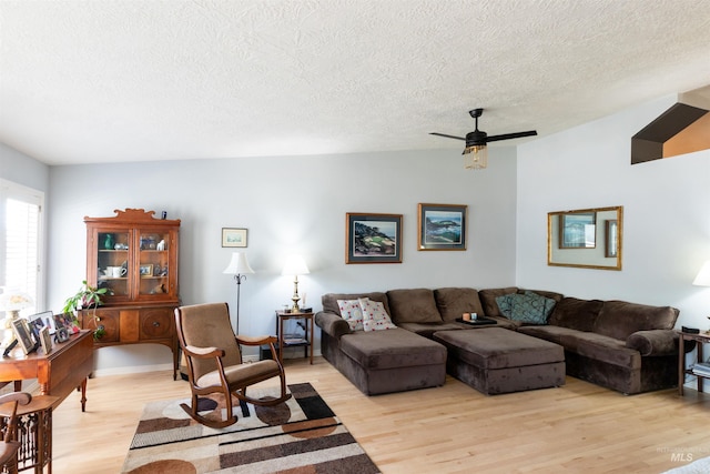 4023 N Bayou Ln, Boise, ID 83703 - living room with a textured ceiling, light wood-type flooring, and a ceiling fan