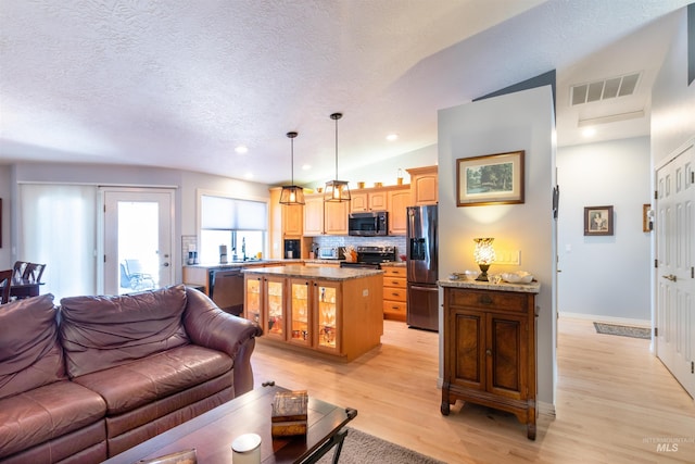 4023 N Bayou Ln, Boise, ID 83703 - living area with light wood-style floors, a textured ceiling, baseboards, and recessed lighting