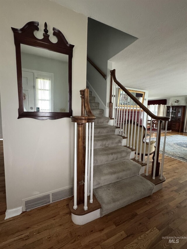 7119 W Everett, Boise, ID 83704 - stairs featuring wood finished floors and baseboards