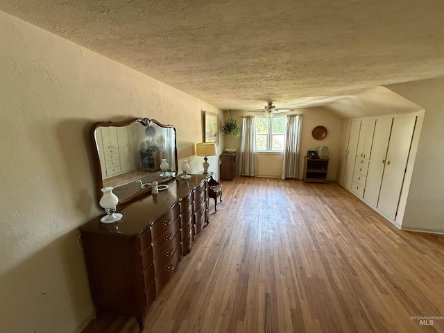 7119 W Everett, Boise, ID 83704 - home office with a textured ceiling, wood finished floors, a textured wall, vaulted ceiling, and baseboards