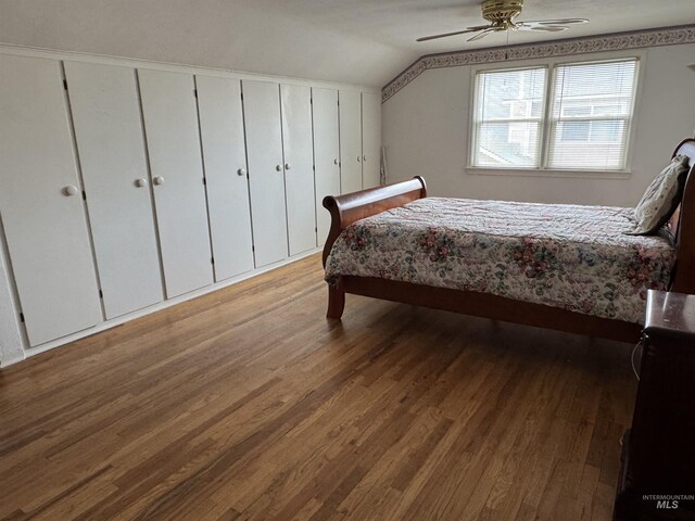 7119 W Everett, Boise, ID 83704 - bedroom featuring wood finished floors, vaulted ceiling, and a ceiling fan