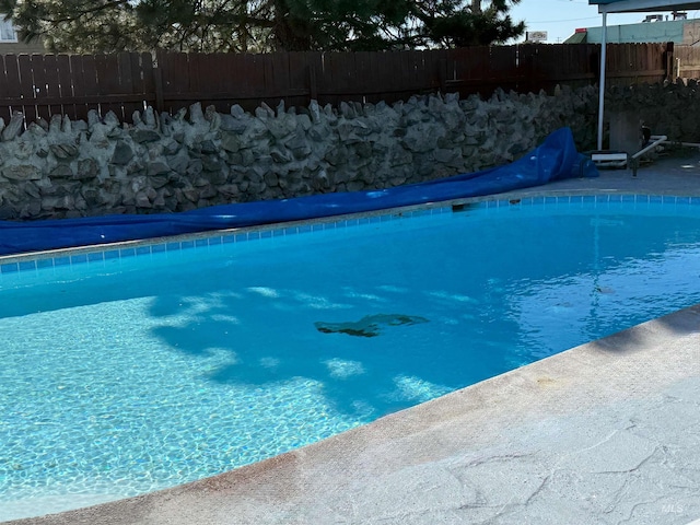 7119 W Everett, Boise, ID 83704 - view of swimming pool featuring fence