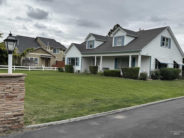 7119 W Everett, Boise, ID 83704 - view of front of house featuring roof with shingles and covered porch