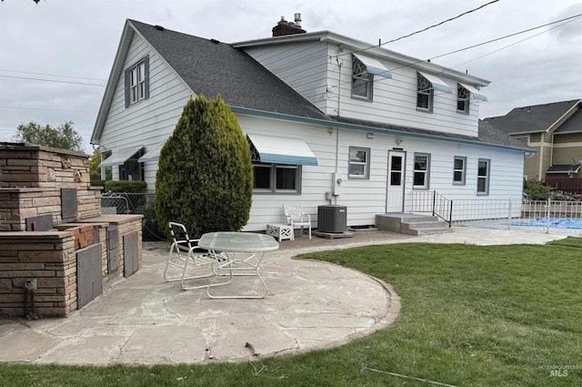 7119 W Everett, Boise, ID 83704 - rear view of house with a patio, cooling unit, roof with shingles, and a chimney