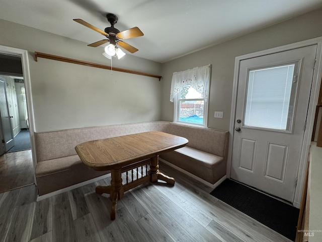 7119 W Everett, Boise, ID 83704 - dining space featuring breakfast area, ceiling fan, wood finished floors, and a wainscoted wall