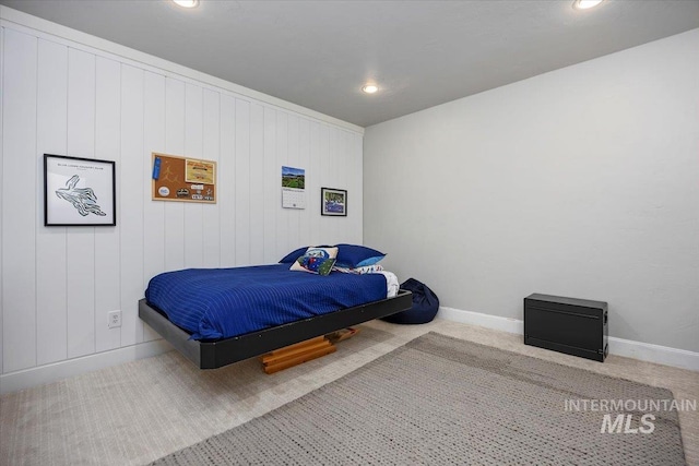 bedroom with recessed lighting, baseboards, and carpet floors