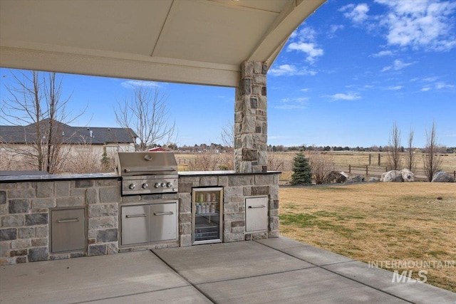 view of patio / terrace with an outdoor kitchen and a grill