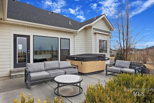 view of patio featuring an outdoor hangout area and a hot tub