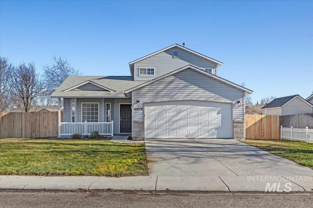 front of property featuring a garage, covered porch, and a front lawn