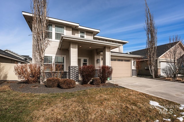 view of front of property with a front lawn and a garage