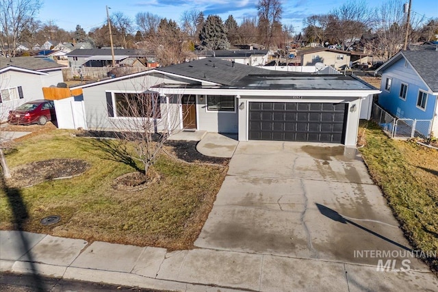 view of front of house with a garage and a front yard