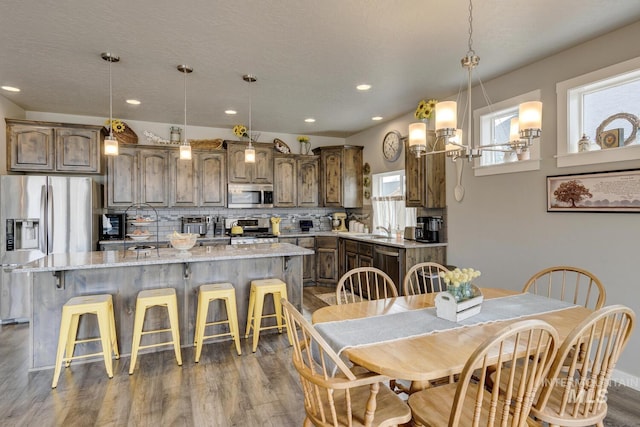 dining space featuring recessed lighting and dark wood-type flooring