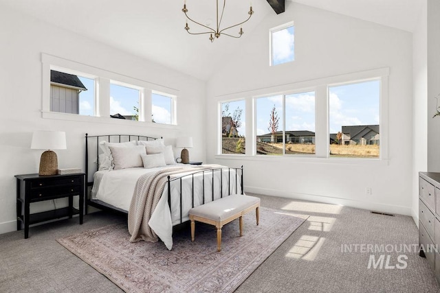 carpeted bedroom featuring beamed ceiling, an inviting chandelier, high vaulted ceiling, and multiple windows