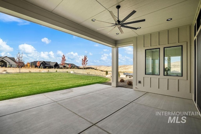 view of patio featuring ceiling fan