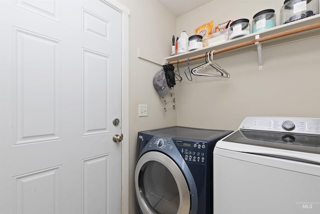 laundry area with independent washer and dryer