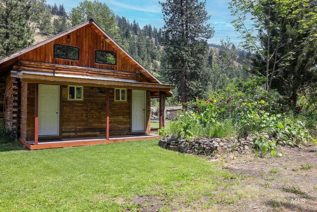 5650 Pines Rd, New Meadows, ID 83654 - rear view of property with a lawn and log exterior