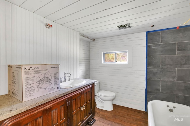 5650 Pines Rd, New Meadows, ID 83654 - full bathroom with a freestanding bath, wood finished floors, vanity, and wood walls