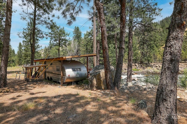 5650 Pines Rd, New Meadows, ID 83654 - view of car parking featuring a view of trees