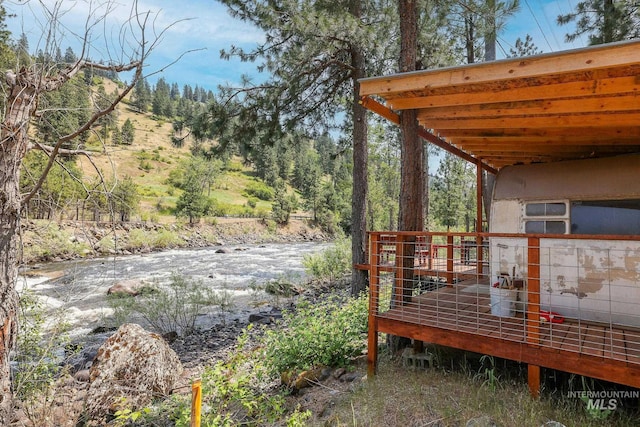 5650 Pines Rd, New Meadows, ID 83654 - wooden terrace with a forest view
