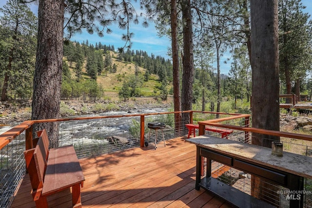 5650 Pines Rd, New Meadows, ID 83654 - deck with a forest view