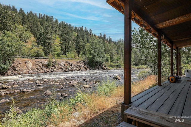 5650 Pines Rd, New Meadows, ID 83654 - wooden deck featuring a forest view