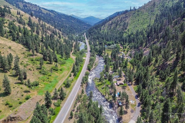 5650 Pines Rd, New Meadows, ID 83654 - aerial view of property and surrounding area featuring a mountain backdrop and a forest