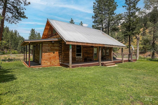 5650 Pines Rd, New Meadows, ID 83654 - back of house featuring a yard, a metal roof, and a porch