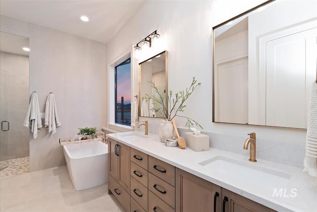 9989 W Bouvardia St, Star, ID 83699 - bathroom featuring double vanity, a shower stall, a freestanding bath, and recessed lighting