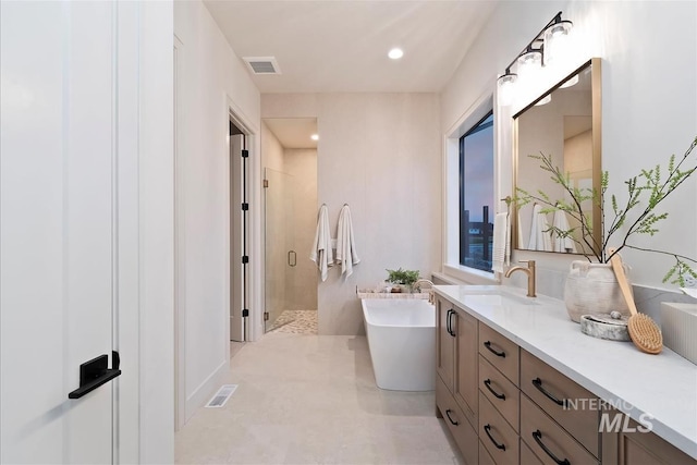 9989 W Bouvardia St, Star, ID 83699 - full bath with vanity, a shower stall, and a freestanding tub
