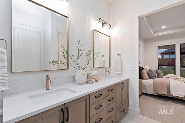 9989 W Bouvardia St, Star, ID 83699 - ensuite bathroom with double vanity and a raised ceiling