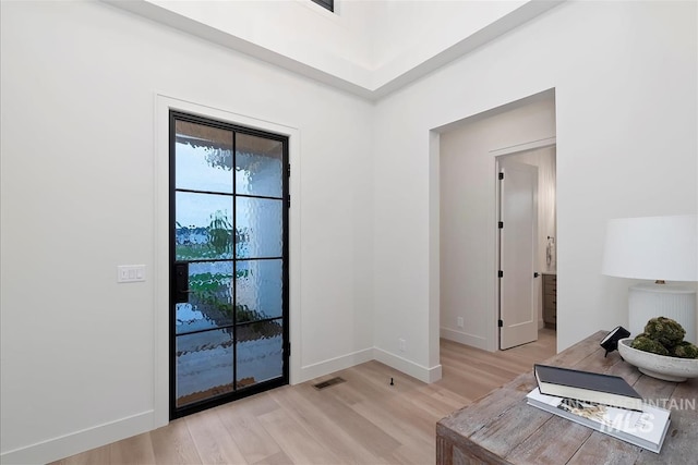 9989 W Bouvardia St, Star, ID 83699 - living area with light wood-style floors and baseboards