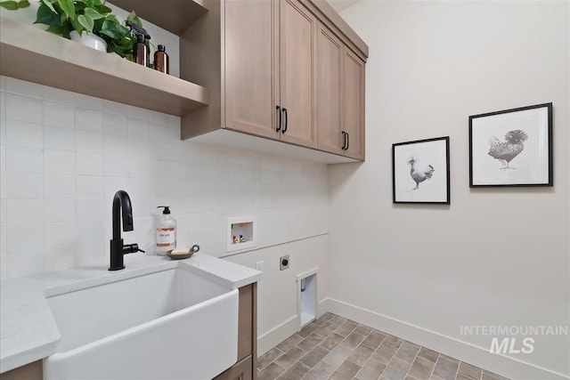 9989 W Bouvardia St, Star, ID 83699 - laundry area featuring cabinet space, electric dryer hookup, baseboards, and hookup for a washing machine