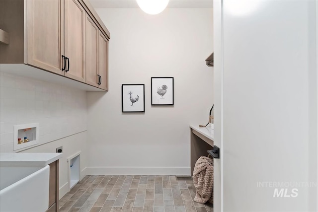 9989 W Bouvardia St, Star, ID 83699 - laundry room featuring cabinet space, electric dryer hookup, washer hookup, and baseboards