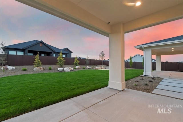 9989 W Bouvardia St, Star, ID 83699 - yard at dusk featuring a patio