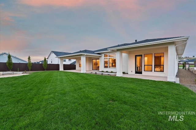 9989 W Bouvardia St, Star, ID 83699 - back of property with a patio area and stucco siding
