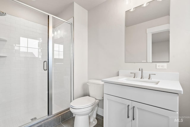 full bathroom with tile patterned floors, toilet, a stall shower, and vanity