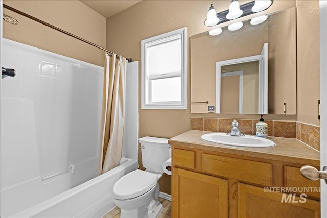 full bathroom with vanity, toilet, and shower / tub combo