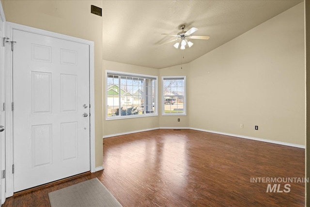 foyer with ceiling fan, dark wood-type flooring, and lofted ceiling